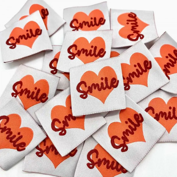 Vævet etiket "Smile" 35 x 35 mm