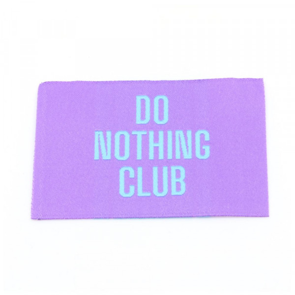 Vævet etiket "Do nothing Club" 57 x 38 mm
