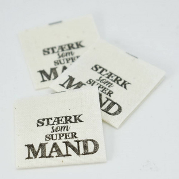 Vaskeanvisning "Stærk som Supermand" 30 x 60 mm...